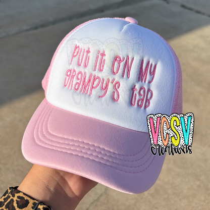 Put it on my ___’s tab trucker Hat